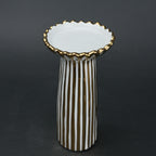 White ceramic candle holder with gold scalloped rim and fluted base for modern home decor styling