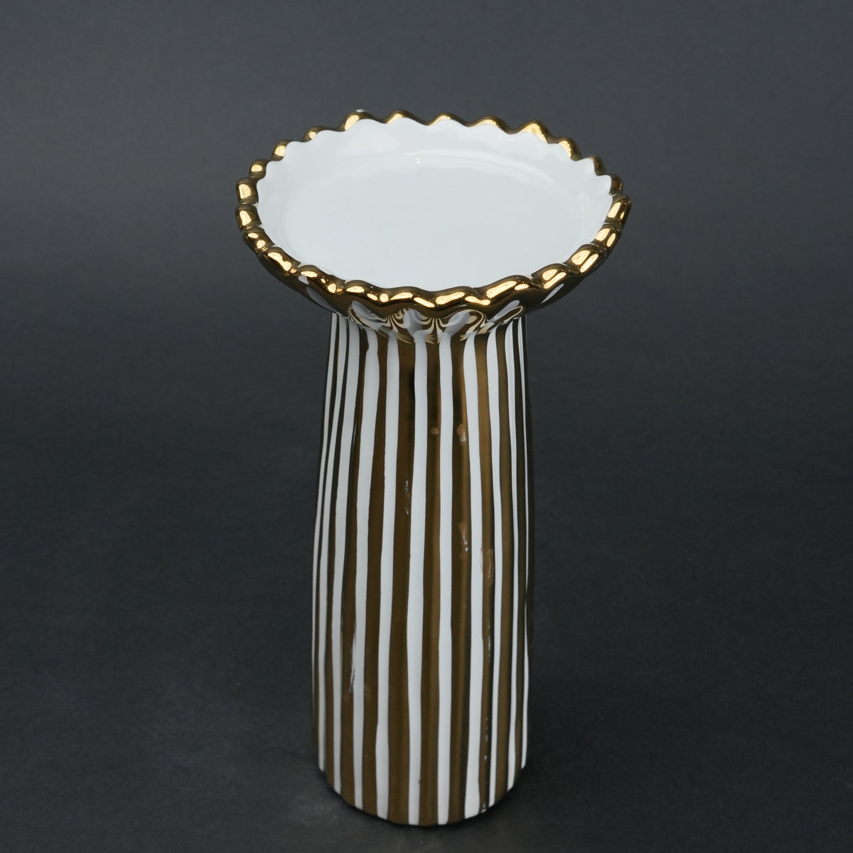 White ceramic candle holder with gold scalloped rim and fluted base for modern home decor styling