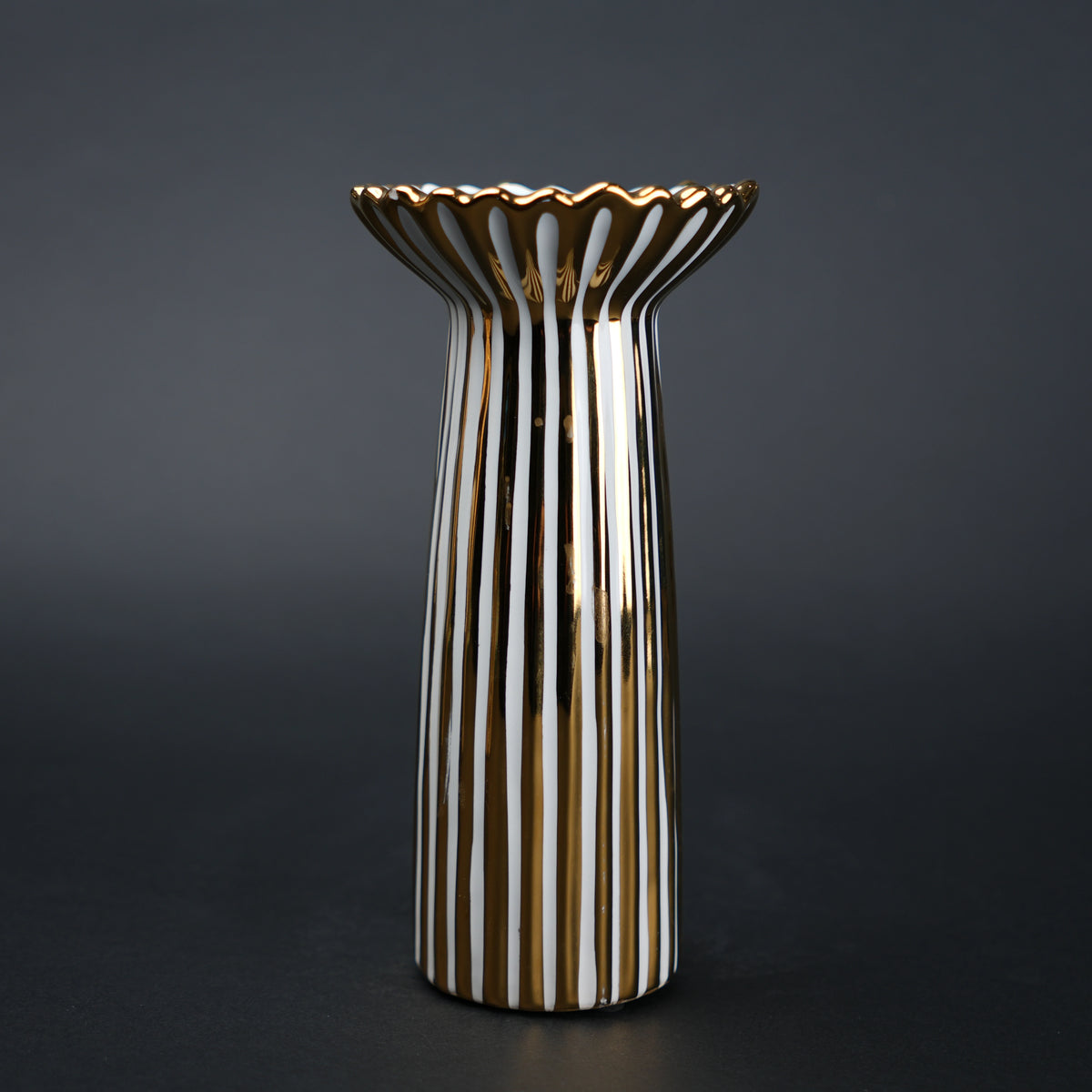 White ceramic candle holder with gold scalloped rim and fluted base for modern home decor styling
