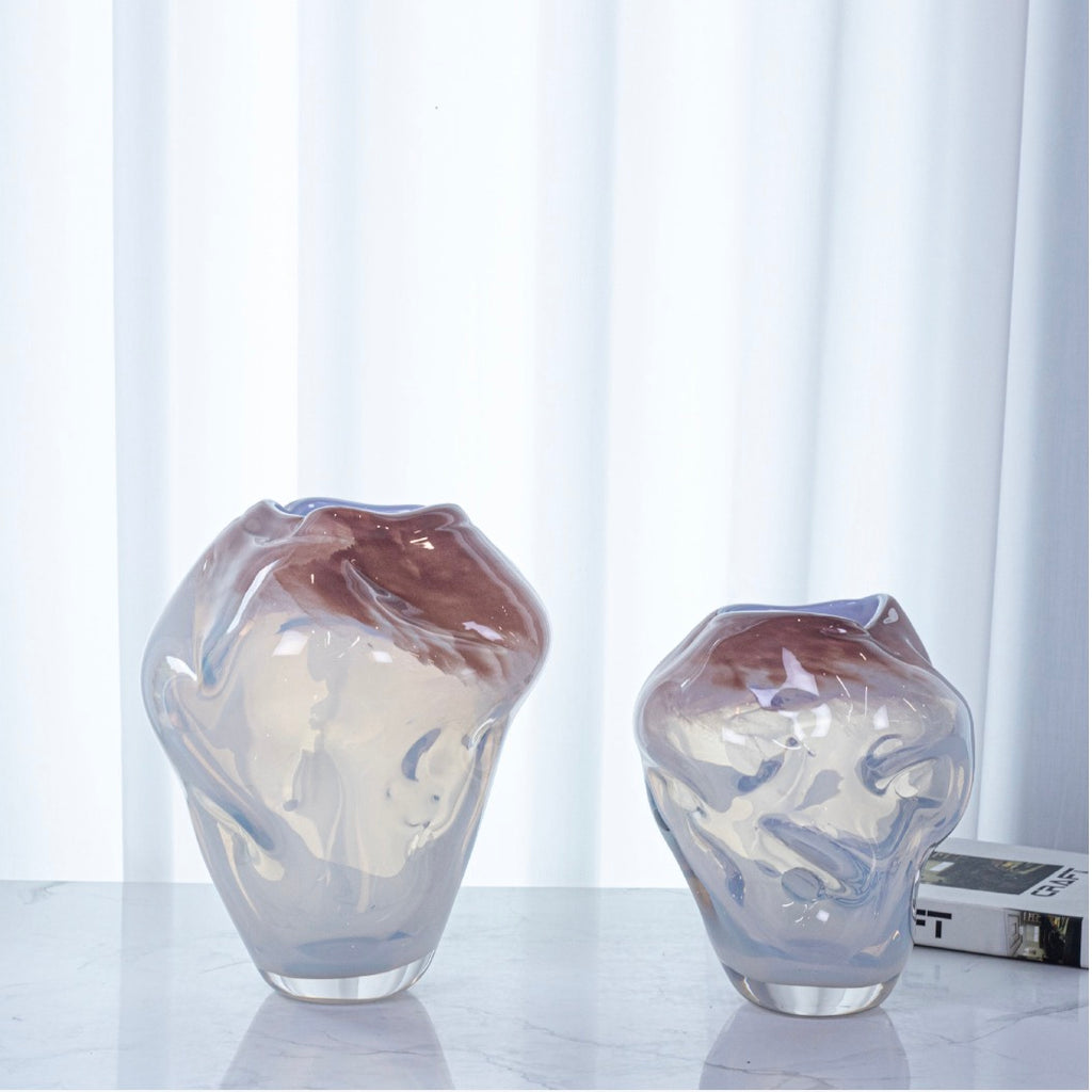 Luxury decorative glass vase with a softly sculpted profile and modern aesthetic.