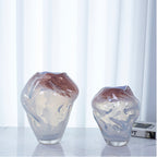 Luxury decorative glass vase with a softly sculpted profile and modern aesthetic.