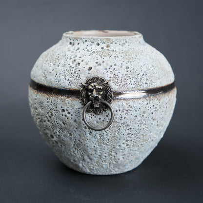 Round stone white lion-ring vase close-up