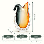 Glass vase with gradient color from gray to orange on a white background