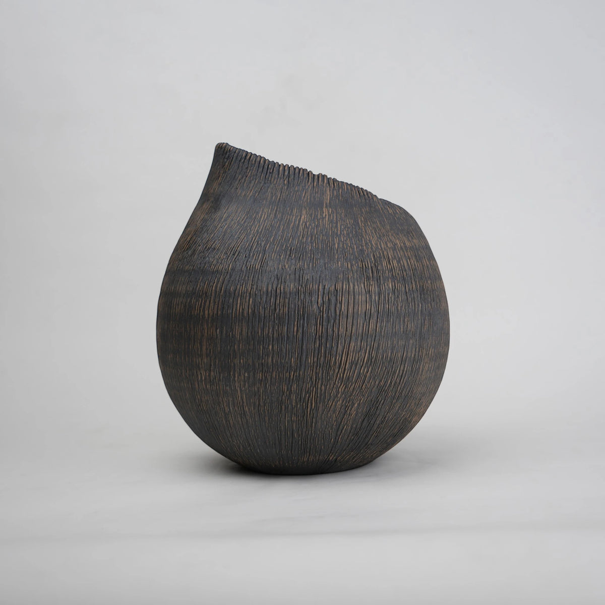 textured charcoal ceramic vase with angled rim