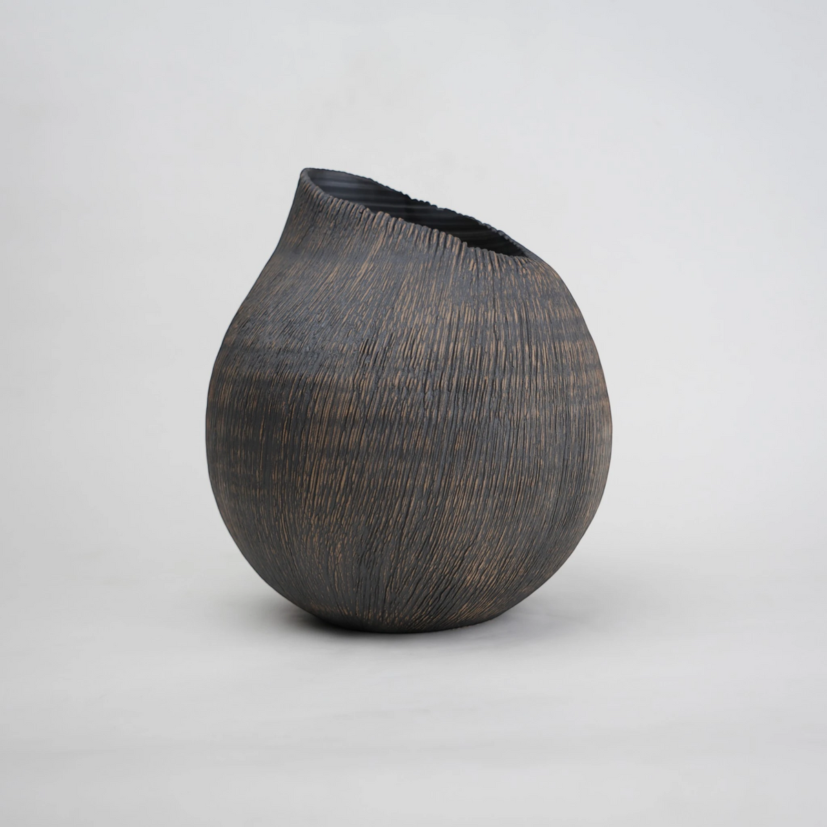 textured charcoal ceramic vase with angled rim