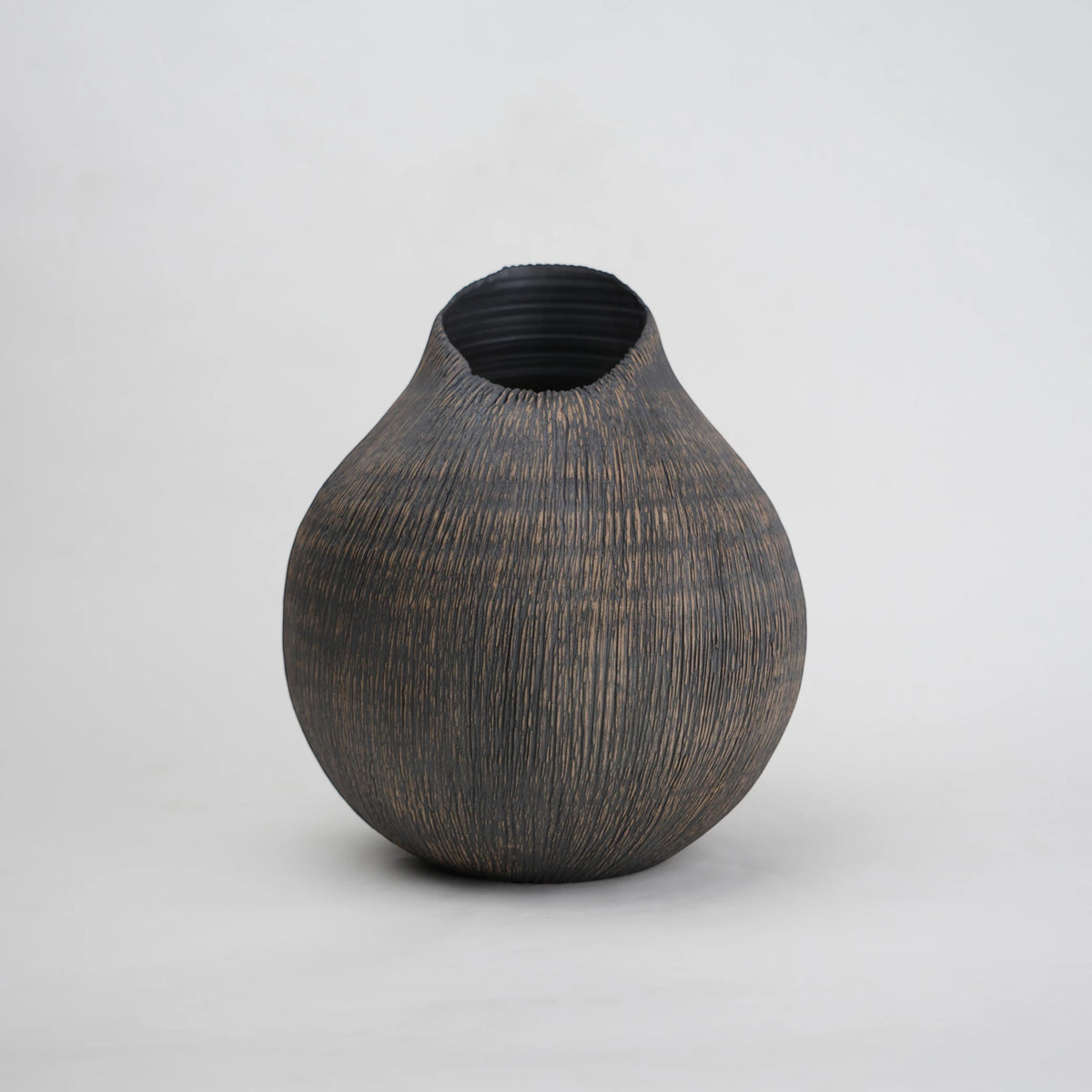 textured charcoal ceramic vase with angled rim