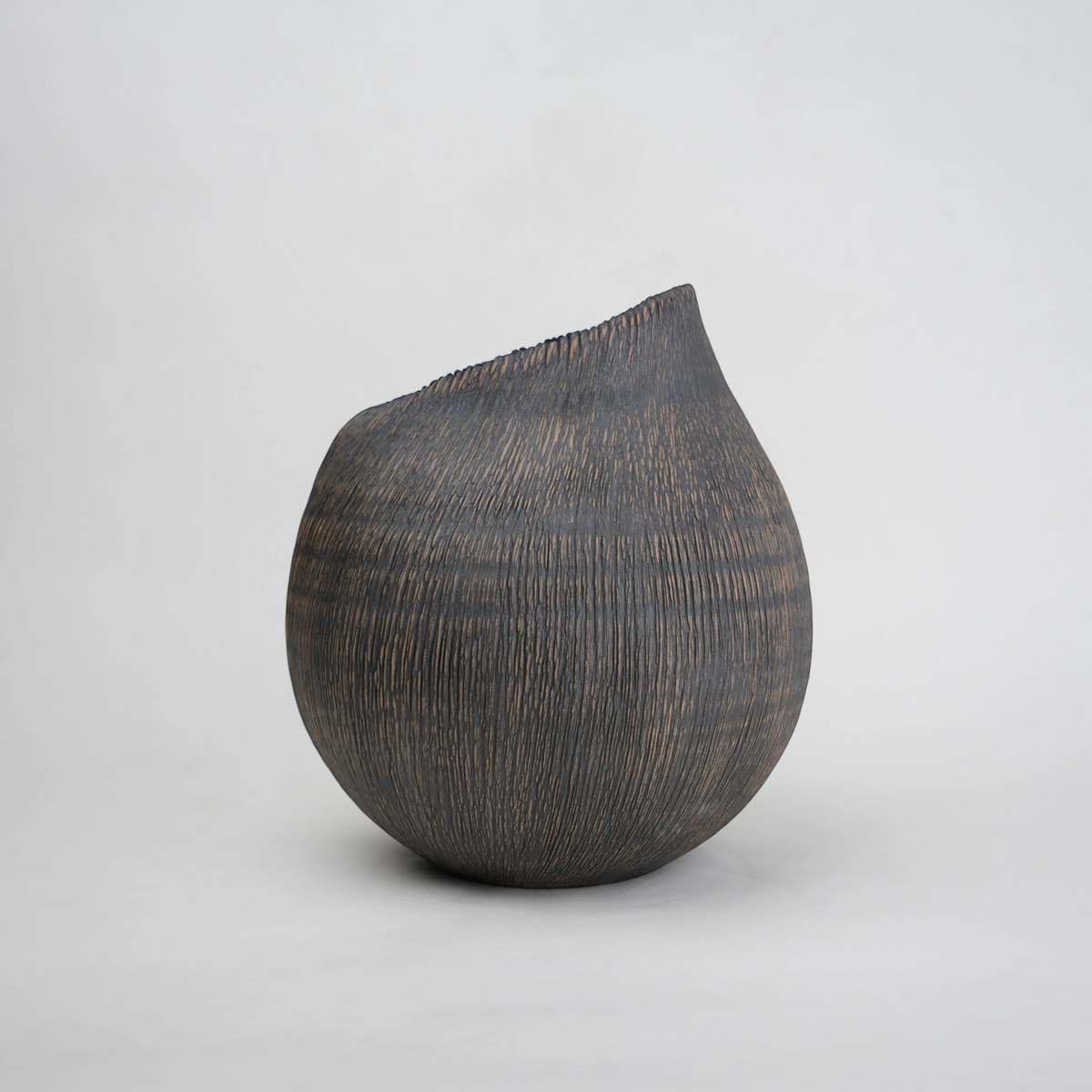 Textured charcoal vase, raked lines front