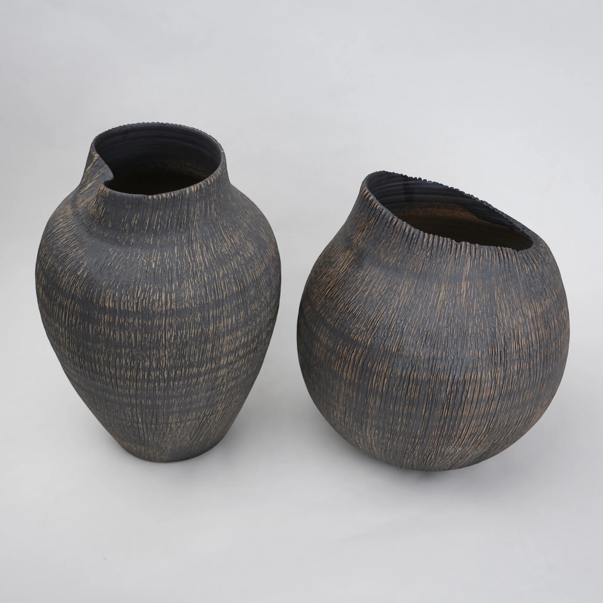 textured charcoal ceramic vase with angled rim
