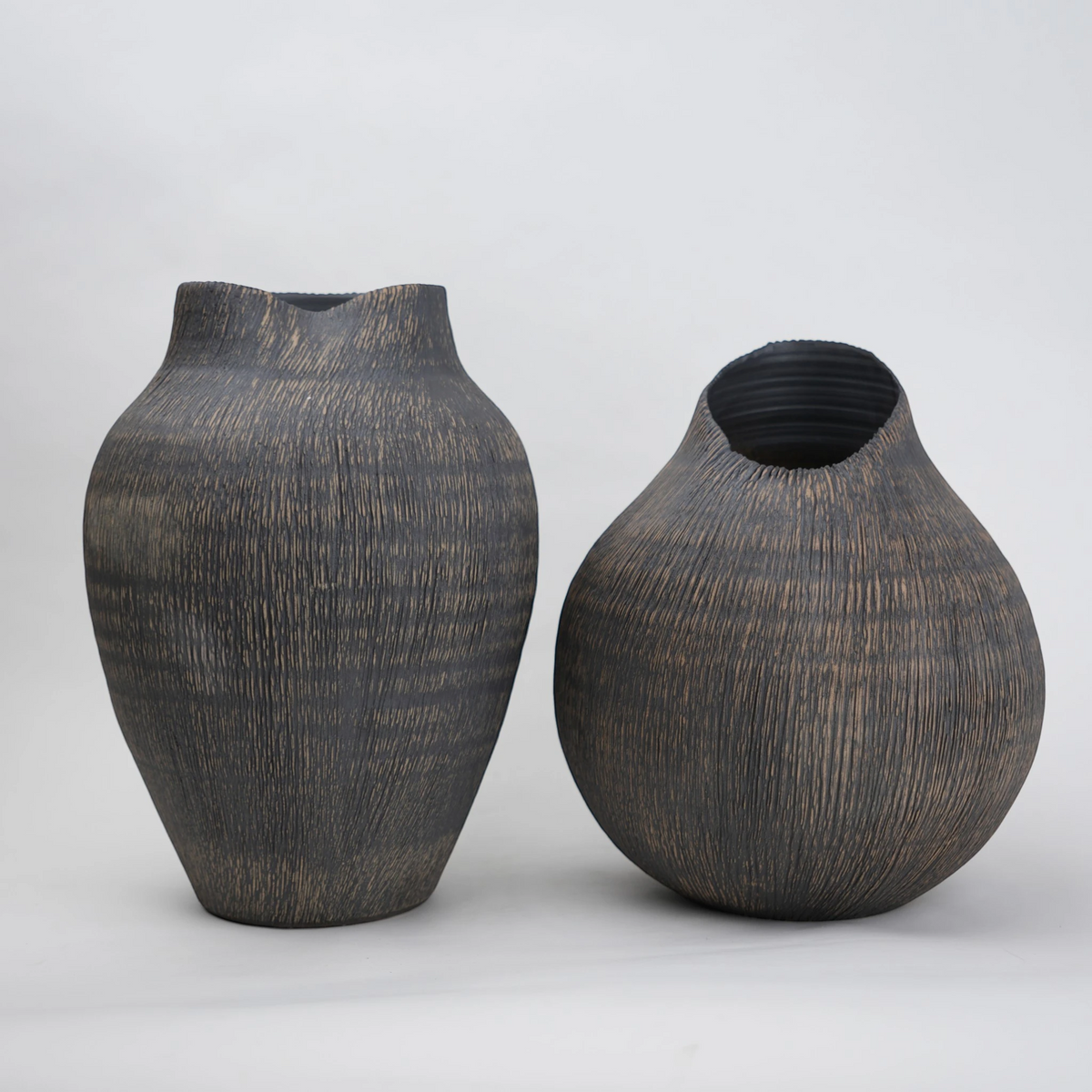 textured charcoal ceramic vase with angled rim