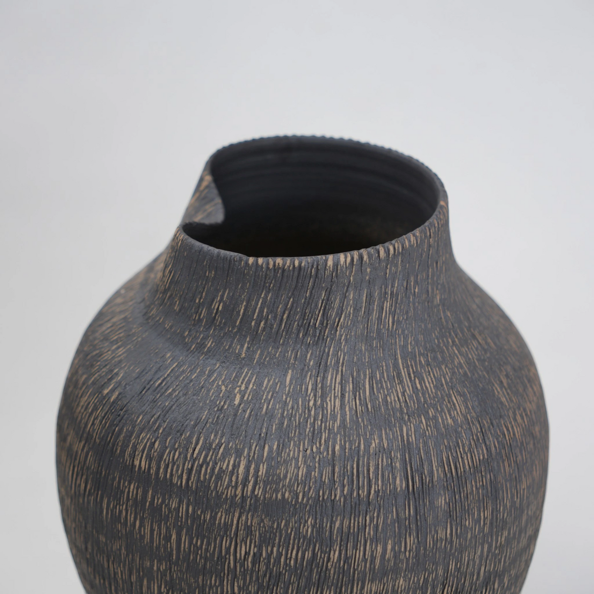 textured charcoal ceramic vase with angled rim