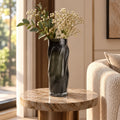 Matte black flow vase elevated angle interior