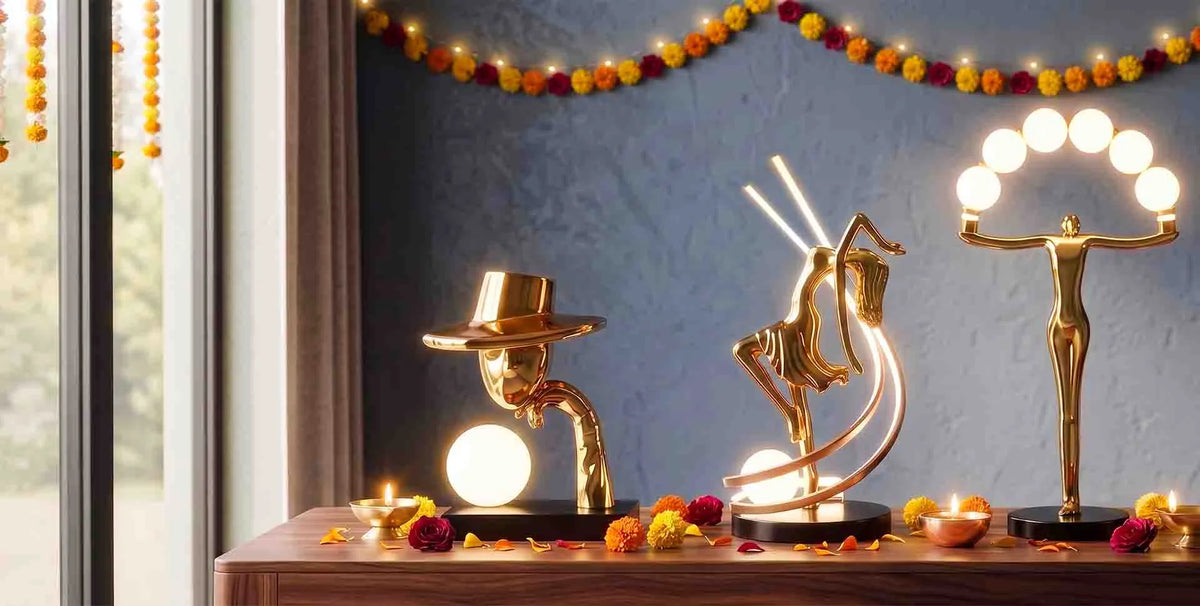 Collection of designer sculptural table lamps with golden figures and ambient lighting