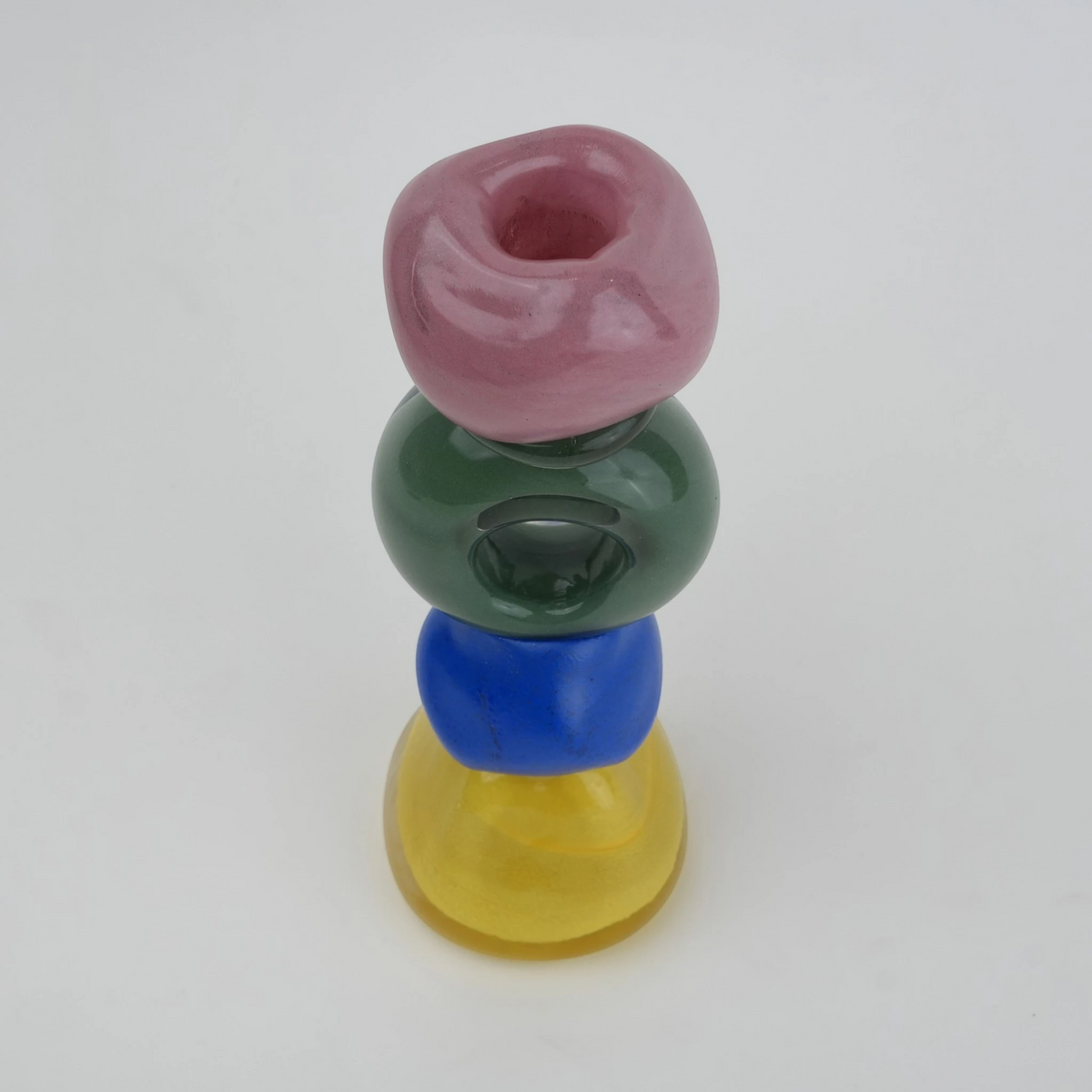 Colorful totem glass candle holder with stacked geometric design and circular ring center