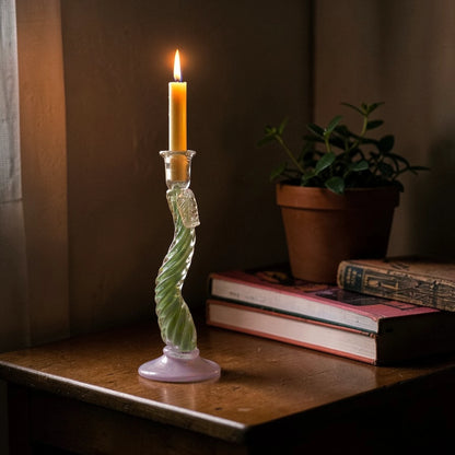 Tall Twist Glow holder lit on desk w/ books