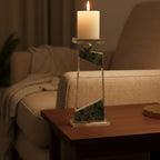 Clear geometric glass candle holder with aqua tinted base and circular design detail