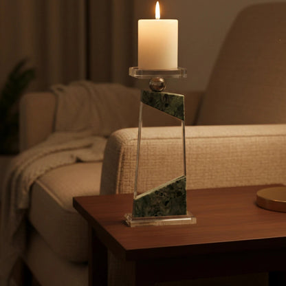 Clear geometric glass candle holder with aqua tinted base and circular design detail