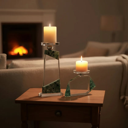 Clear geometric glass candle holder with aqua tinted base and circular design detail