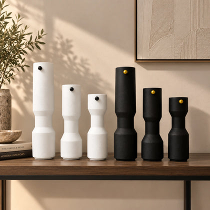 three modern white decorative flower vases with matte finish and black accent detail, minimalist table vases for living room, console or shelf styling