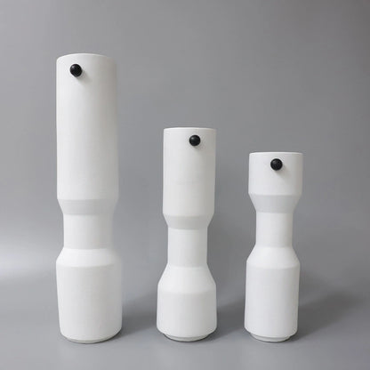 three modern white decorative flower vases with matte finish and black accent detail, minimalist table vases for living room, console or shelf styling