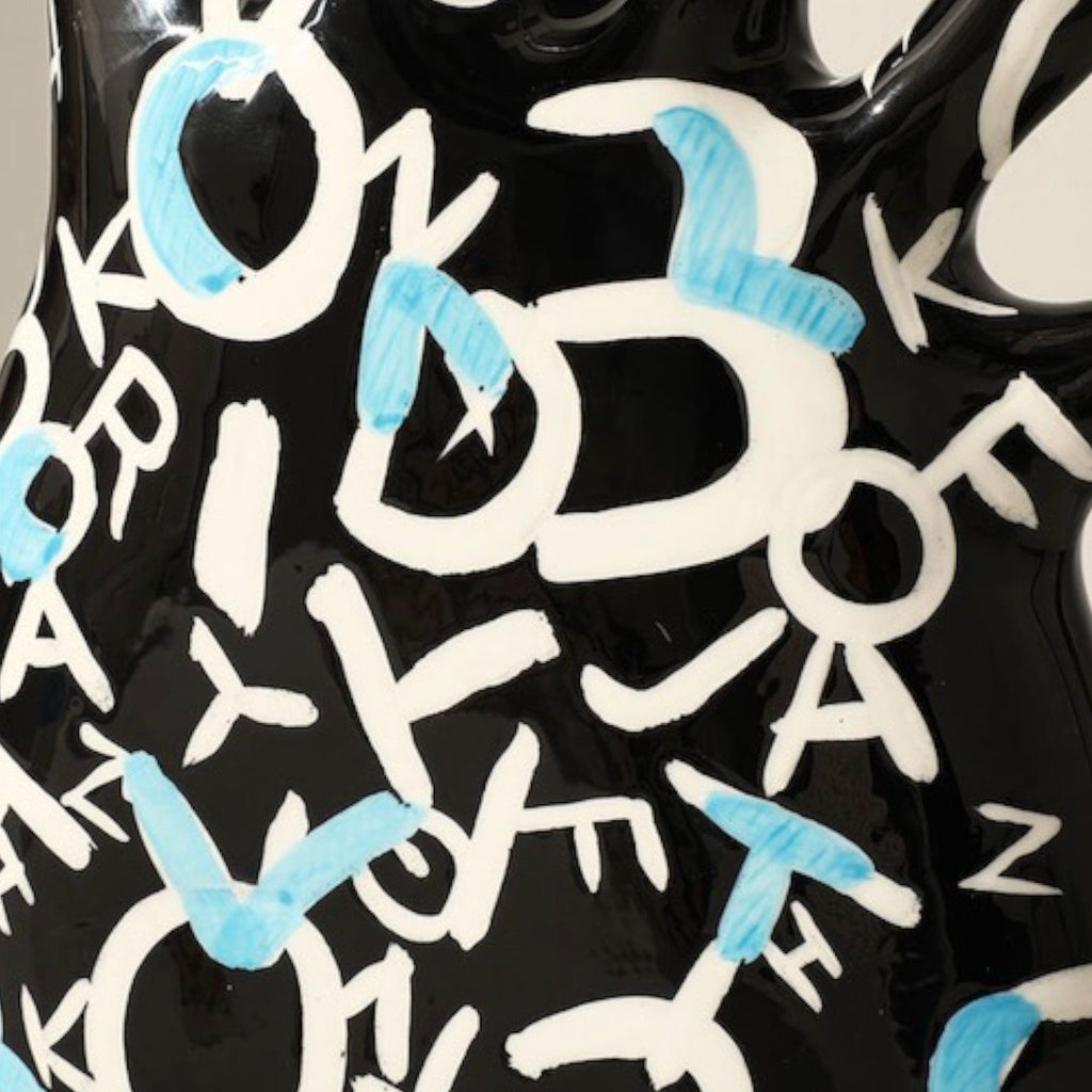 Alphabet vase black letters macro detail