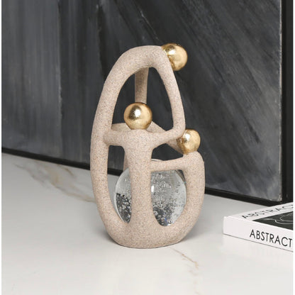 Artful Balance: Matte & Gold Orb Sculpture