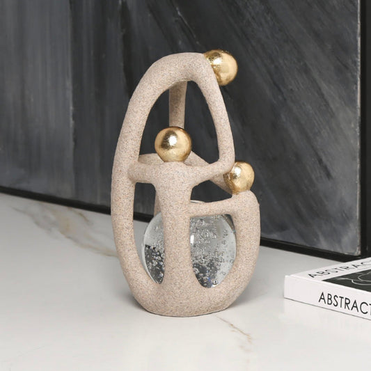 Artful Balance: Matte & Gold Orb Sculpture
