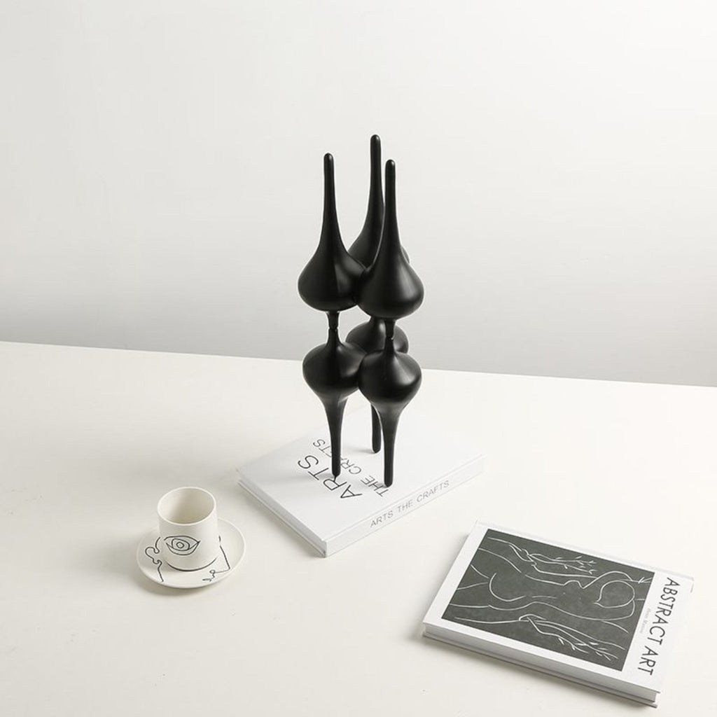 Noir column on white desk w/ teacup