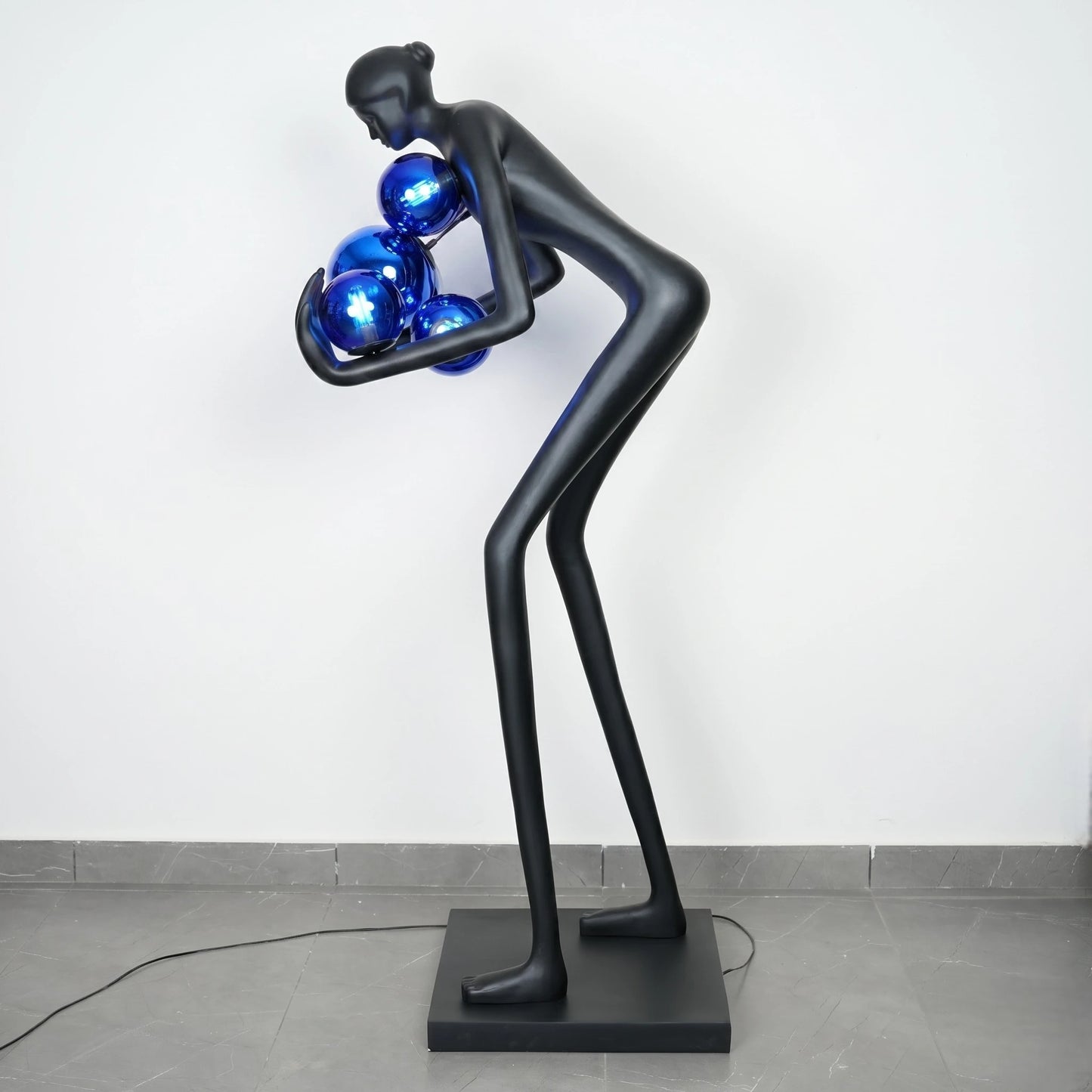Glow figure lamp, blue globes, profile shot