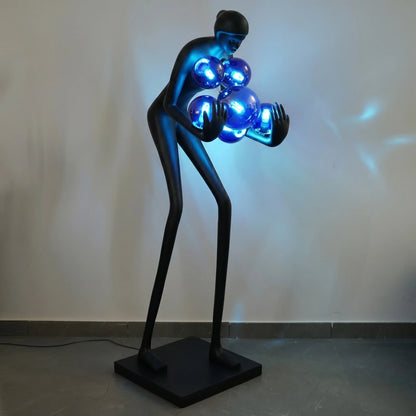 Glow figure lamp, cobalt lit, dim room 3/4