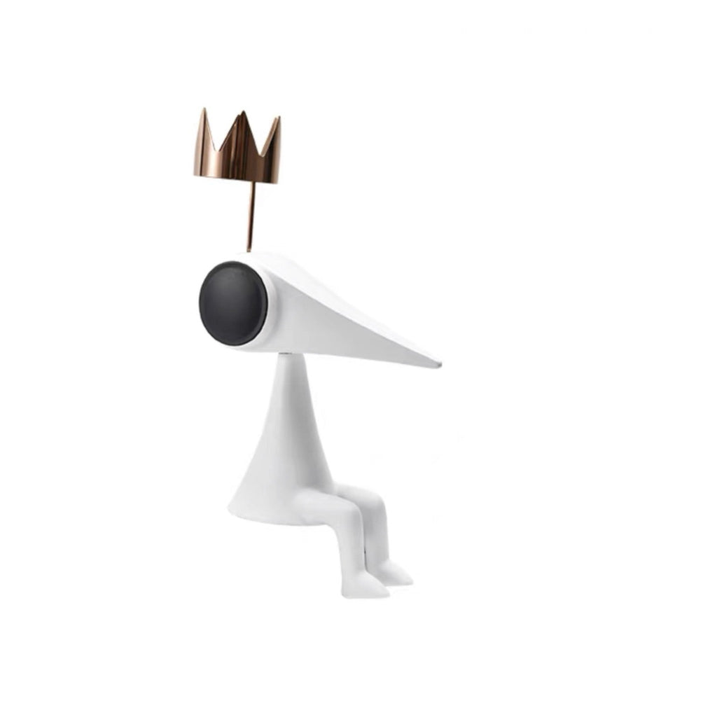 Gold crowned figure cutout on white