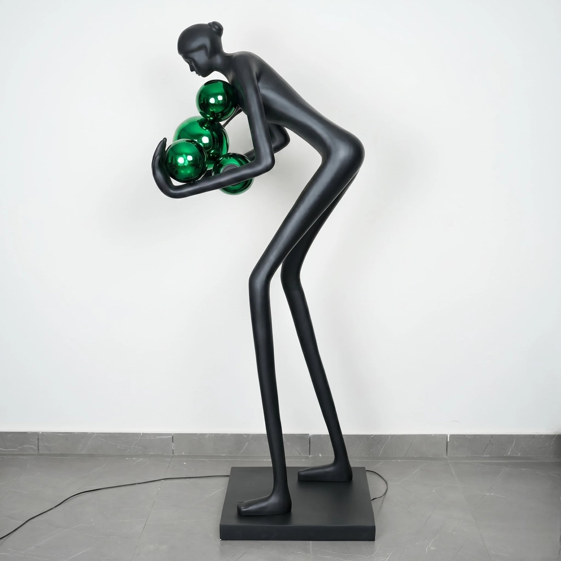 Glow figure lamp, emerald orbs, side studio