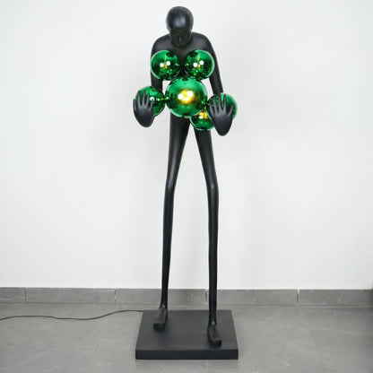 Glow figure lamp, green chrome orbs, head-on