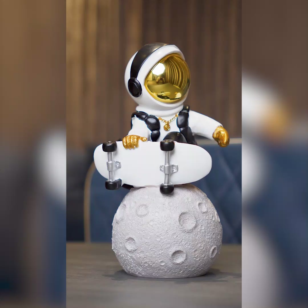 white cosmic skater astronaut figurine sitting on moon with skateboard