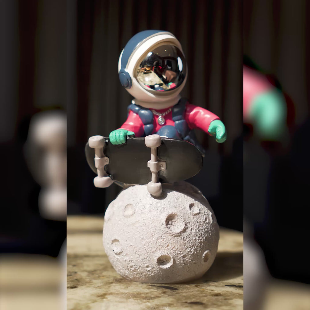 Artistic astronaut decorative figurine with moon base and colorful detailing for premium interiors