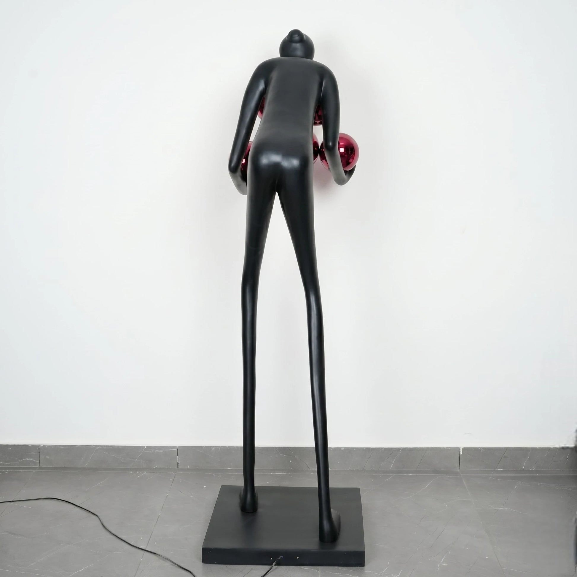 Glow figure lamp, red orbs, rear studio shot