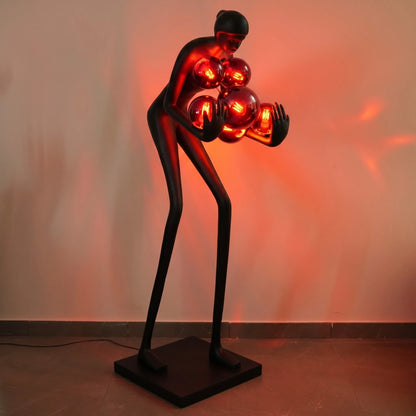 Glow figure lamp, red globes lit, lifestyle