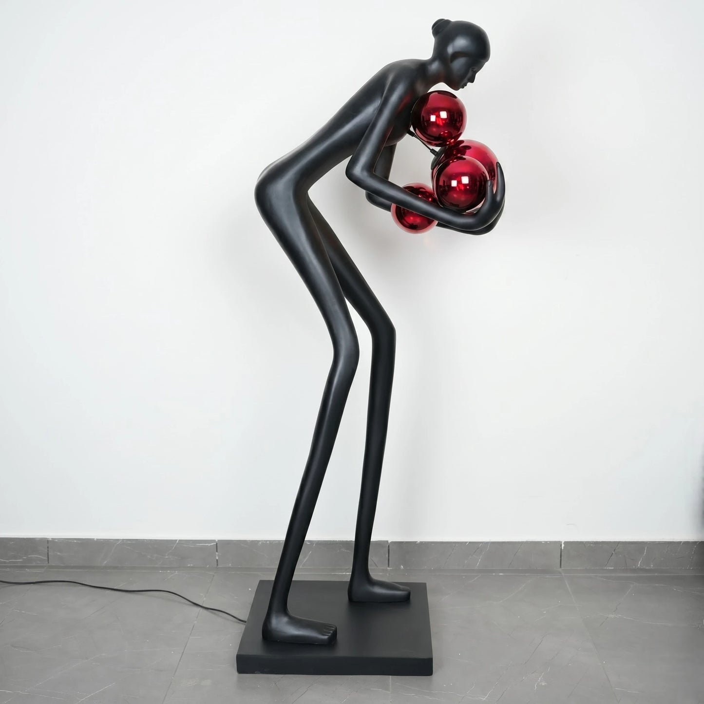 Glow figure lamp, crimson orbs, 3/4 view