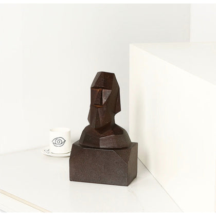 Abstract Moai head sculpture in dark brown geometric finish, modern tribal face decor for luxury interiors